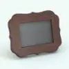 Curved Revit Picture Frame Family rendered in 3D and with a dark-colored wood finish. This family can either be used as a picture frame or as a painting (if you remove the glass and choose an image for the central space). Totally parametric and easy to use, this Revit picture frame family is truly flexible!