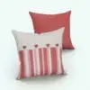 Square Revit Cushion Family With Heart Buttons rendered in 3D with red-pink-tan colored materials and red heart-shaped buttons to add a playful touch to it. Ideal for casual interior design projects, this Revit cushion family will bring joy and coziness to your 3D renderings.