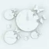 Butterflies Wall Clock Revit Family in different sizes and configurations to showcase its parametric flexibility.
