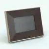 Wood Slanted Profile Revit Picture Frame in 3D and rendered with a dark wood finish with metallic outer frame to add contrast. This fully parametric family is ideal for all your interior design projects since it not only serves as a table frame, but also as a wall picture frame (or art piece). Get this Wood Slanted Profile Revit Picture Frame family now and see for yourself.
