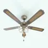 Traditional Refined Ceiling Fan Revit Family in 3D and rendered in a dark wood with a light colored woven texture inlay and gold metallic accents and housing. This fully parametric Revit ceiling fan is ideal for traditional interiors that exude elegance.