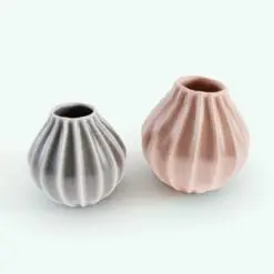 Curved Sprocket Flower Vase 3D Model in 3D and rendered in Vray. This model includes 2 different vases (slightly different in shape) and two different textures for added versatility. Ideal for adding a touch livability and coziness to any project, this photorealistic-looking flower vase 3D model will make your projects and 3D renders stand out in just a few clicks.